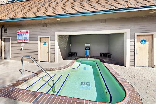 a swimming pool in the back of a house at Lakeland Village South Lake Tahoe in South Lake Tahoe