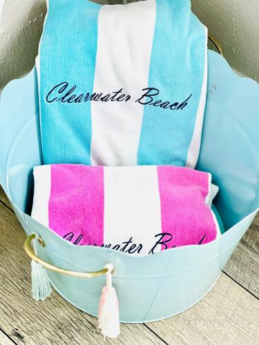 a basket filled with towels and towels at Paradise Hideaway Entire guest home near beach in Clearwater