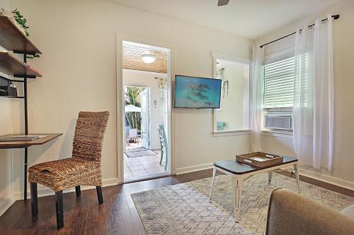 a living room with a table and a chair at Steps to Beach & Downtown! Cozy Beach Bungalow #4 in Lake Worth