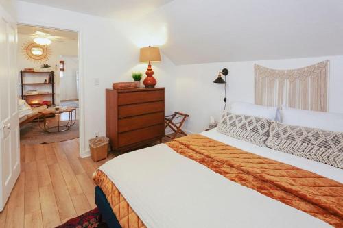 a bedroom with a large bed and a desk at Classic & Cozy Apartments - Parking & Close To Dw in Medford