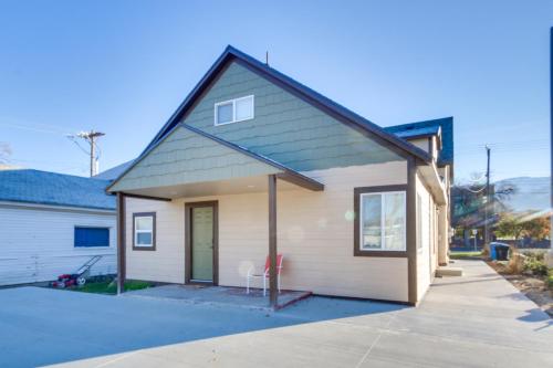 a small white house with a garage at Stylish Logan Retreat with Smart TV and Central AandC! in Logan