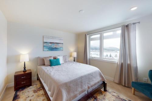 a bedroom with a bed and a large window at La Bonte Townhomes Unit 304 in Dillon