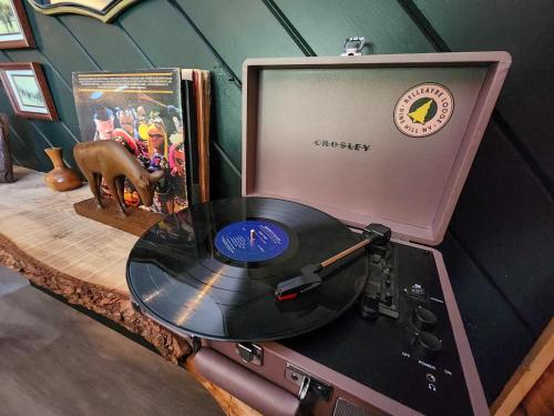 a record player with a vinyl record on a counter at Belleayre Lodge in Pine Hill
