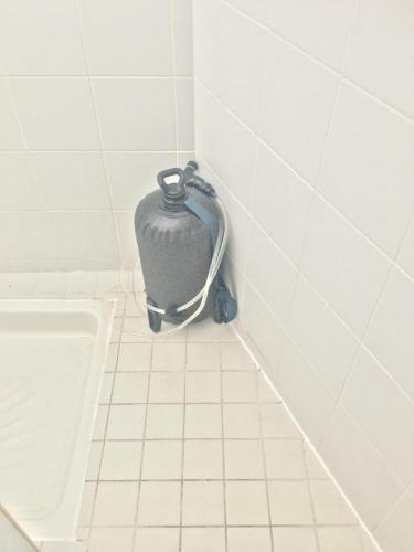 a pot sitting in the corner of a bathroom at Good Mood Studio - Manganao in Saint-François