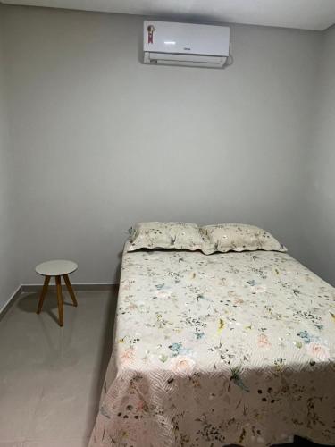 A bed or beds in a room at Casa de temporada da vó zelina