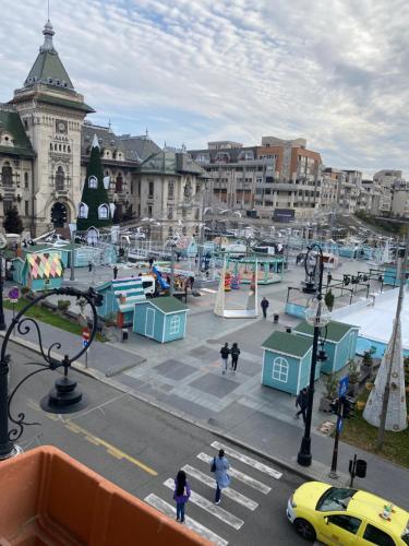 a view of a city with people and a playground at Blue light ultracentral in Craiova
