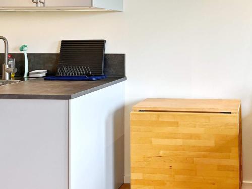 a laptop sitting on top of a counter in a kitchen at 5 person holiday home in MUNSö-By Traum in Solsidan
