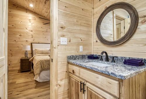 A bathroom at Jolly Jingle Cabin, Pickleball Court, Creek, WIFI, Mountain Views, Starting at 79"