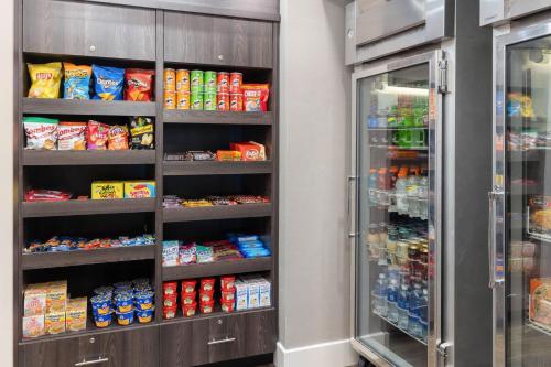 a refrigerator filled with lots of food and drinks at Residence Inn Providence Coventry in West Greenwich