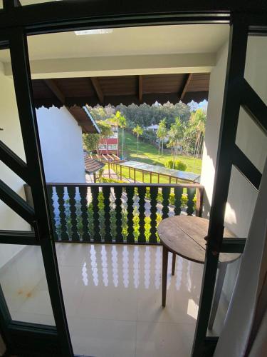 a balcony with a table and a view of a park at Spazio Vital Apartments in Florianópolis