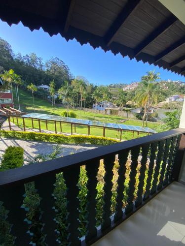 a balcony with a view of a park at Spazio Vital Apartments in Florianópolis