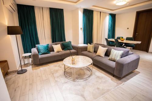 a living room with a couch and a table at Veronique Heights in Kumasi