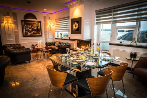a dining room with a table and chairs at Hotel Keflavik by Reykjavik Keflavik Airport in Keflavík