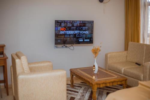 A television and/or entertainment centre at LEYSHOF HOTEL