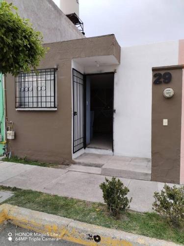 a building with a door with a gate on it at Casa Hortensia in La Cañada