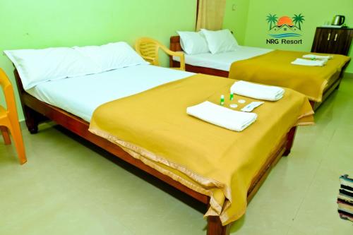 Postel nebo postele na pokoji v ubytování NRG Resort