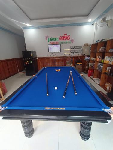 a blue ping pong table in a store at Orchid 101 in Kampot