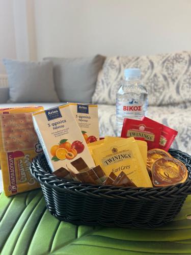 a basket filled with food on a table at EVa's Luxury Apartments No 4 in Artemida