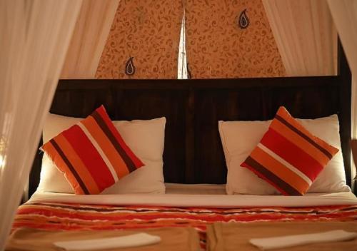 Postelja oz. postelje v sobi nastanitve The Reef Resort Shivrajpur
