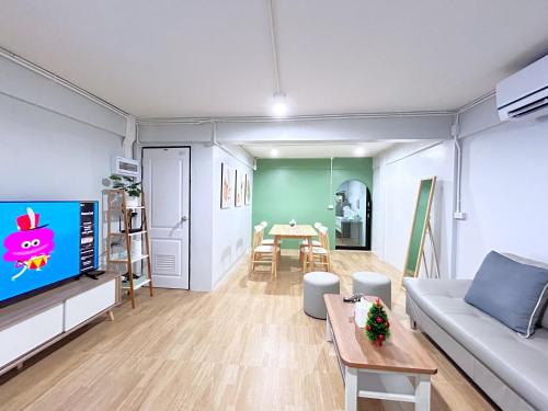 a living room with a couch and a table at HDY 66 home in Hat Yai