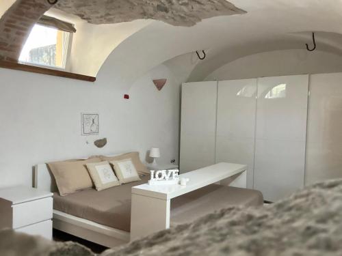 a bedroom with a bed and a sink in it at B&B Il Piccolo Principe room and breakfast in Bieno
