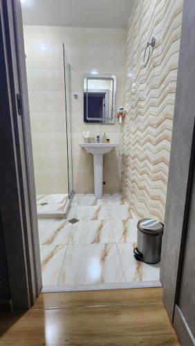a bathroom with a sink and a mirror at Luxor Rabath in Akhaltsikhe