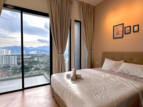 a bedroom with a bed and a large window at New 2BR Georgetown Warm and Lovely Homestay 10pax-无敌美景两房民宿 Beacon Executive Suite in George Town