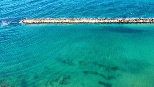an aerial view of a pier in the ocean at Oltremare in Bari