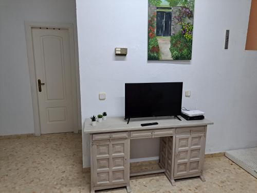 a television sitting on a desk in a room at SAN FELIPE in Carmona