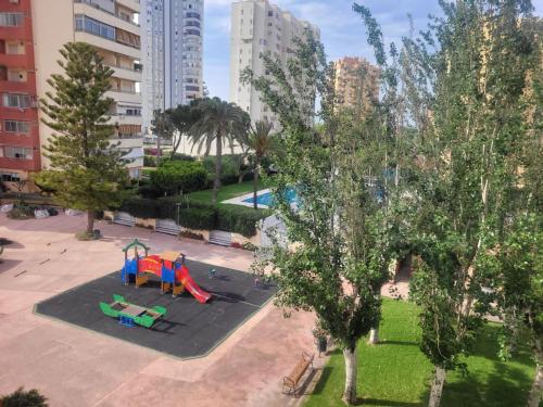 an aerial view of a playground in a city at Amplio apartamento in Puebla de Farnals