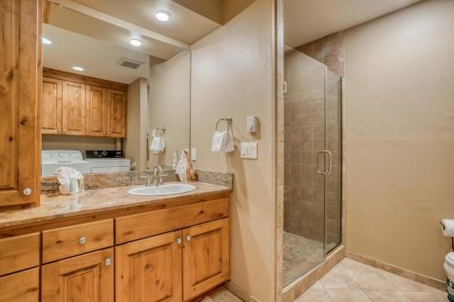 a bathroom with a sink and a shower at Lincoln City Beach House in Lincoln City