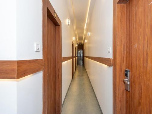 a long hallway with a door and a long hallway at Hotel Zillion Executive Near US Consulate Bandra Kurla Complex Mumbai Near Mumbai Airport Mumbai in Mumbai