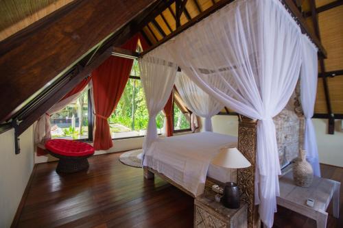 Ένα ή περισσότερα κρεβάτια σε δωμάτιο στο Anima Retreat Bali