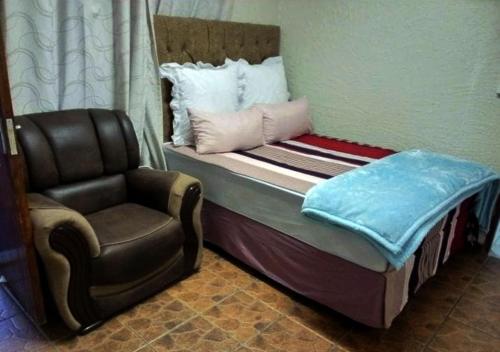Un ou plusieurs lits dans un hébergement de l'établissement NSK GUEST HOUSE