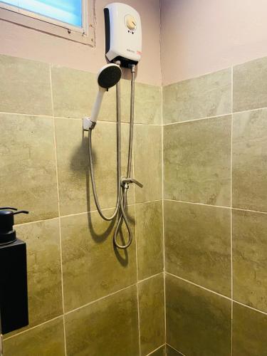 a blow dryer in a shower in a bathroom at HIP Seaview Resort @ Phi Phi in Phi Phi Don