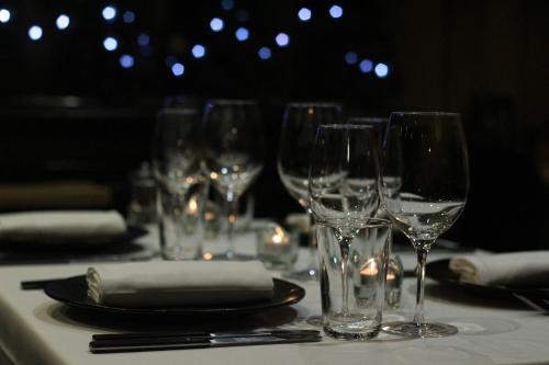 a group of wine glasses sitting on a table at Hotel du Lac in Villars-sur-Ollon