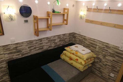 a room with three pillows sitting on a bench at Kamping u Łukasza in Zakopane