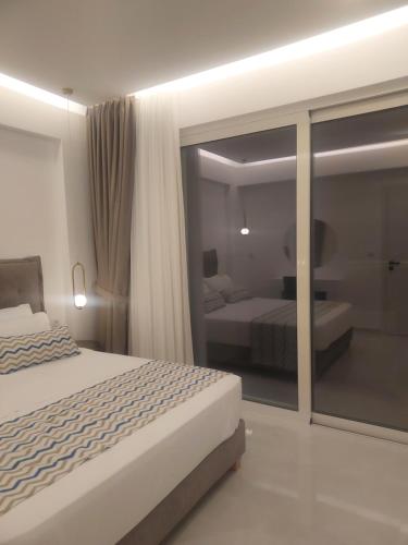Postel nebo postele na pokoji v ubytování Oceana Suites