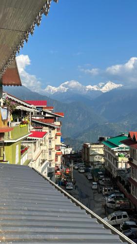 a view of a city with mountains in the background at DISHA SILVER PEAK Hotel in Pelling