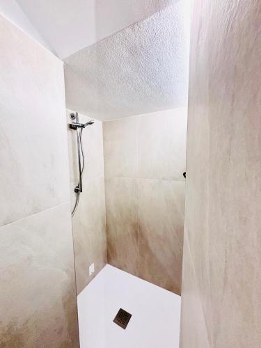 a bathroom with a shower with a glass door at Residenza Bra Verona in Verona
