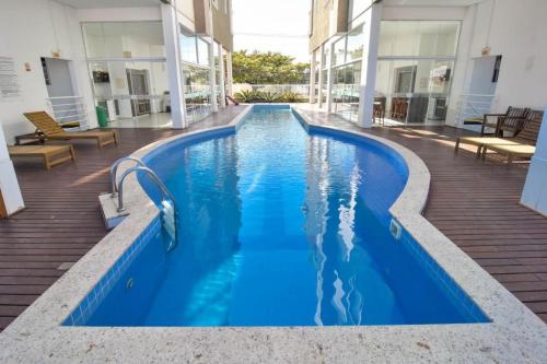 The swimming pool at or close to Deixe a energia fluir e contaminar suas férias.