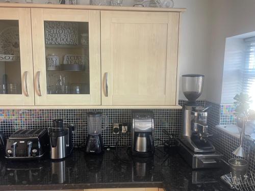 a kitchen with a counter top with a coffee maker at Leamington Loft in Leamington Spa