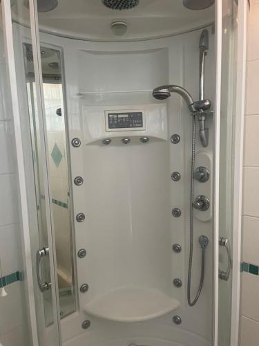 a shower in a bathroom with a glass door at Leamington Loft in Leamington Spa