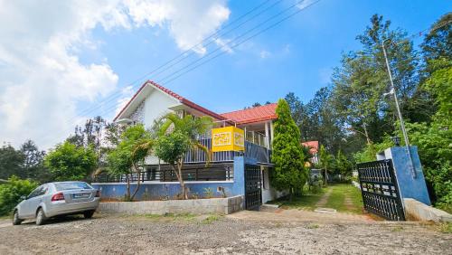a house with a car parked in front of it at iSTAYS - Luxe Villa, Yercaud in Yercaud