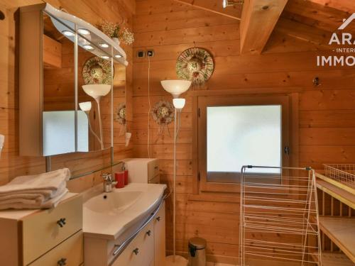 a bathroom with a sink and a mirror at Chalet Le Grand-Bornand, 10 pièces, 18 personnes - FR-1-391-29 in Le Grand-Bornand