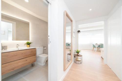 a bathroom with a sink and a toilet at Soler Apartments in Sant Adria de Besos