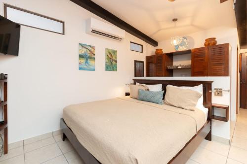a bedroom with a large bed in a room at Luxury Flamingo villa with outdoor bar - pool and magnificent views in Playa Flamingo