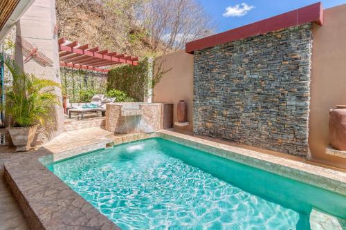 a swimming pool in the backyard of a house at Luxury Flamingo villa with outdoor bar - pool and magnificent views in Playa Flamingo