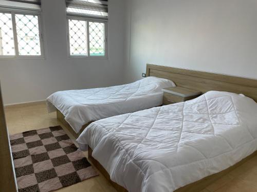 Llit o llits en una habitació de Oskar Appartment 2