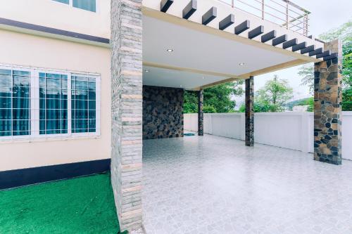 an external view of a house with a patio at AABAN House 03 in Hat Yai